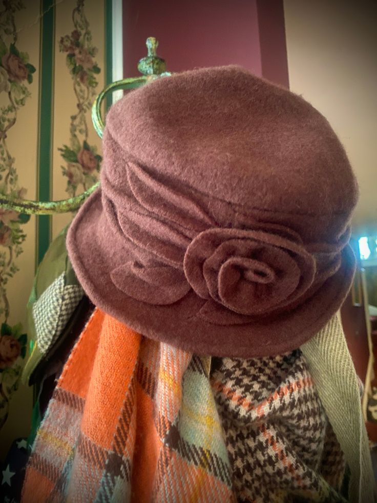 The demure wool cap that could be spotted at a Parisian café on a brisk autumn day…the wearer sipping a mocha cappuccino in the same rich brown hue. This cozy hat alludes to your eyes. (Also available in cream: White & Woolly Hat.) Pure, brushed cashmere blend is knit from soft yarns, and adorned with hand-turned piece-work appliquésOne comfy size fits all (we have tested the size on diverse heads!). Luxury Brown Women's Cloche Hat, Winter Brown Cloche Hat, Classic Brown Cloche Hat, Elegant Brown Wool Cloche Hat, Mocha Cappuccino, Brown Vintage Cloche Hat, Chanel Hat, Wooly Hats, Wool Caps