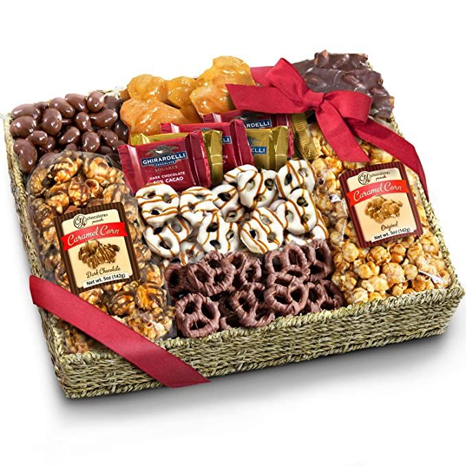 a happy father's day gift basket with pretzels, chocolates, cookies and candies