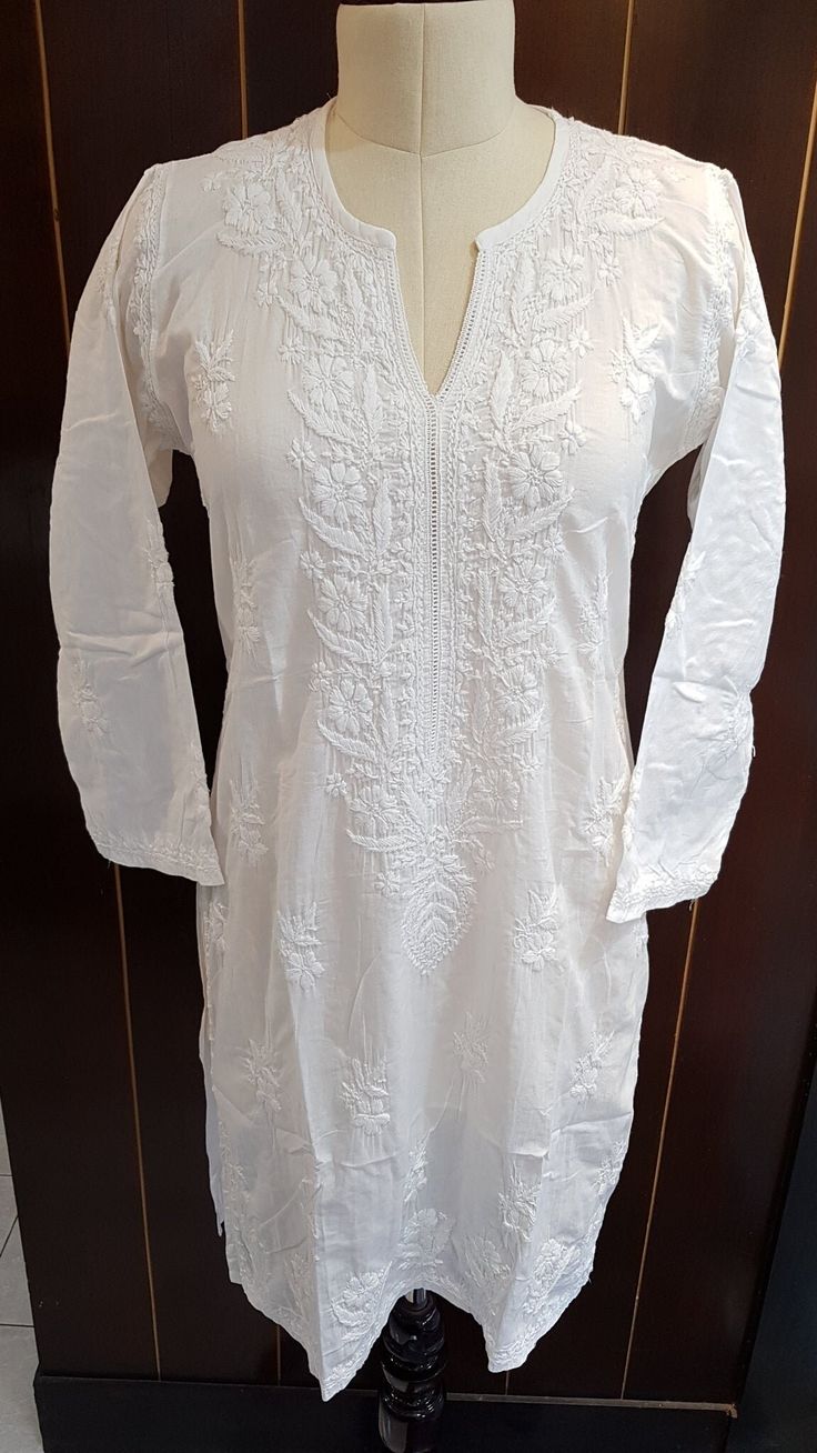 Our Mal tunics are any wardrobes staple. Made from soft breathable lightweight cotton, this tunic is as durable and breezy as you can imagine. Neck with Lace inserts. Full sleeves. Hand embroidered by skilled artisans of lucknow, uttar pradesh, home to the famous chikankari embroidery. Our Short Kurta length falls at 36/37 inches with side slits for comfort Available in sizes : S - bust 36 M - bust 38 L - bust 40 XL - bust 42 0X - bust 44 1X - BUST 46 Robe Diy, Chikankari Embroidery, Short Kurta, White Tunic, Lace Insert, Uttar Pradesh, Diy Dress, Full Sleeves, Womens Tunics