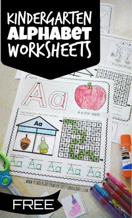 an alphabet worksheet is shown with crayons and markers on the table