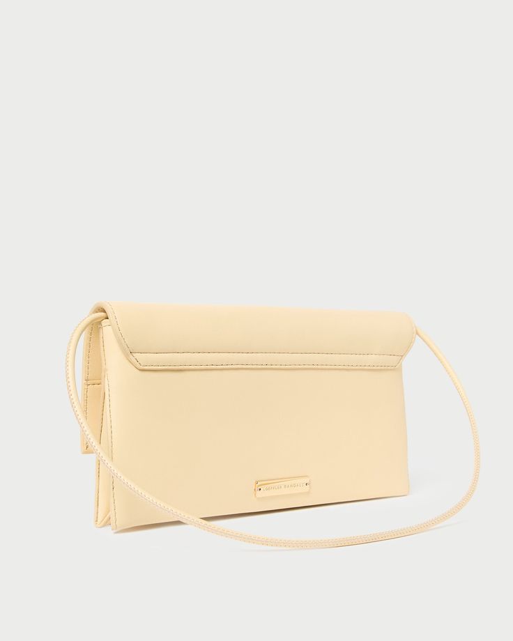 Hand-sewn flap shoulder bag in sweet butter yellow leather. Features a removable strap and exterior metal logo plaque. Cream Rectangular Shoulder Bag With Magnetic Closure, Classic Beige Baguette Bag With Detachable Strap, Classic Cream Flap Bag For Everyday, Cream Baguette Shoulder Bag With Detachable Strap, Cream Shoulder Flap Bag For Everyday, Everyday Cream Shoulder Bag With Magnetic Closure, Cream Everyday Shoulder Flap Bag, Cream Shoulder Flap Bag With Detachable Strap, Classic Cream Flap Bag For Evening