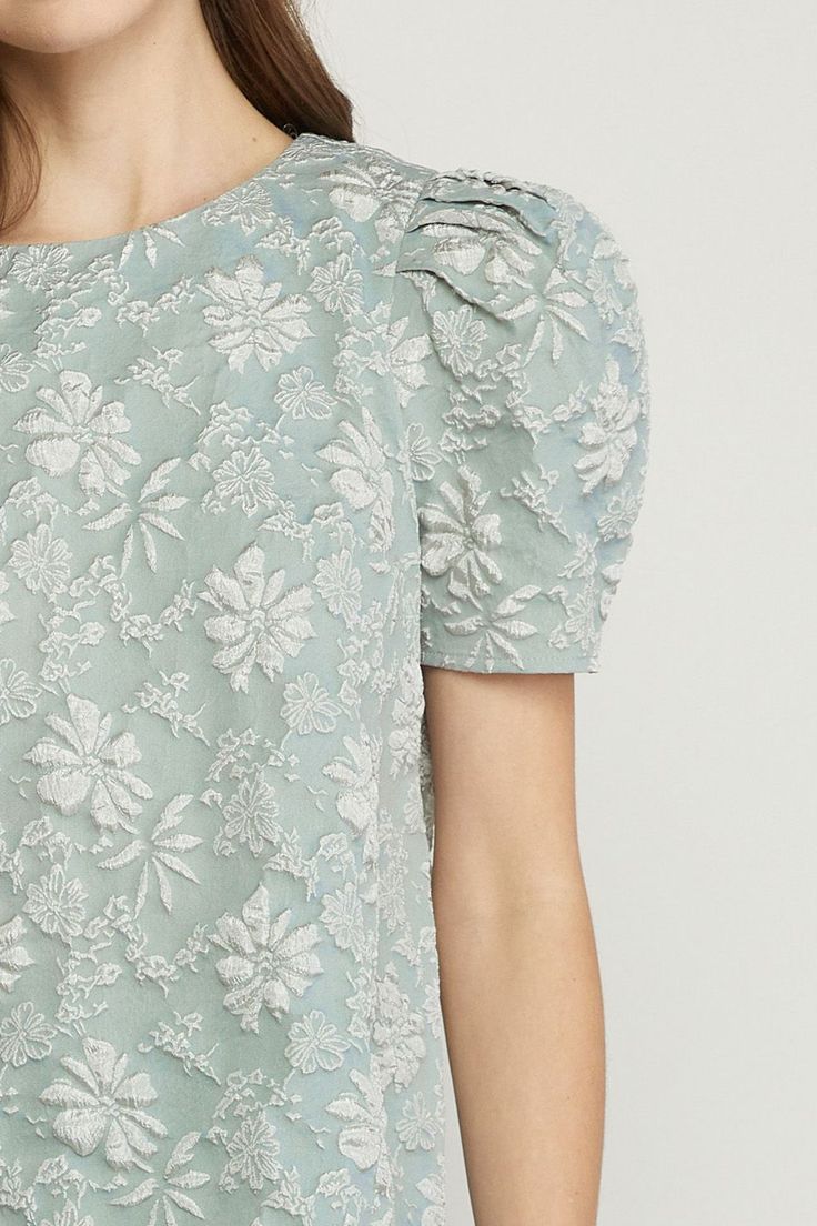 This top is giving us Steel Magnolia vibes! The floral texture so beautiful!! - Key hole back closure - 95% Polyester, 5% Elaistine Small 2-4, Medium 6-8, Large 10-12, XL 14-16 Textured Feminine Summer Tops, Feminine Textured Summer Tops, Textured Puff Sleeve Summer Tops, Summer Feminine Textured Tops, Textured Puff Sleeve Tops For Summer, Summer Textured Puff Sleeve Tops, Fitted Textured Blouse For Spring, Steel Magnolias, Sweet Top