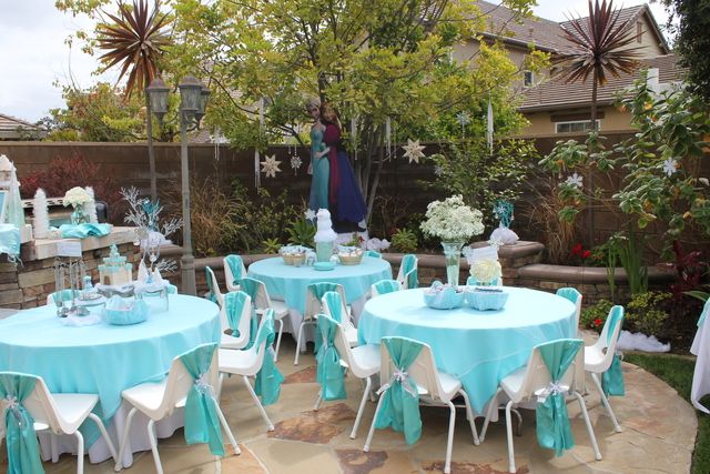 an outdoor party with blue and white decorations