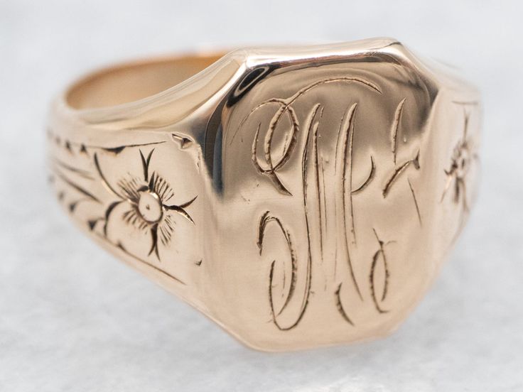 This antique signet ring has a lovely refined look to it. The sweet daisy flowers along the shoulders give just enough texture to draw the eye, without being ostentatious. We've left the original monogram "M" done in beautiful French Script. Please note that this signet ring has its original monogram, unfortunately, this piece cannot be altered without affecting the quality of the piece, please feel free to contact us to help you find your perfect signet ring in your style and budget! Metal: 14K Antique Rose GoldTop Measurements: 12 x 9 mm, Rectangle Monogram: "M" in French ScriptRing Size: 4Marks: "14K" Stamped on the inside band French Script, Daisy Flowers, Antique Roses, Daisy Flower, Signet Ring, The Eye, The Sweet, To Draw, Daisy