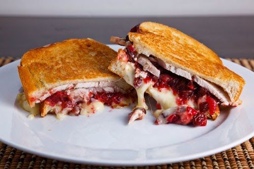 a cut in half sandwich sitting on top of a white plate