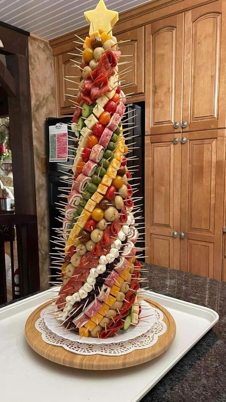 a very large christmas tree made out of food