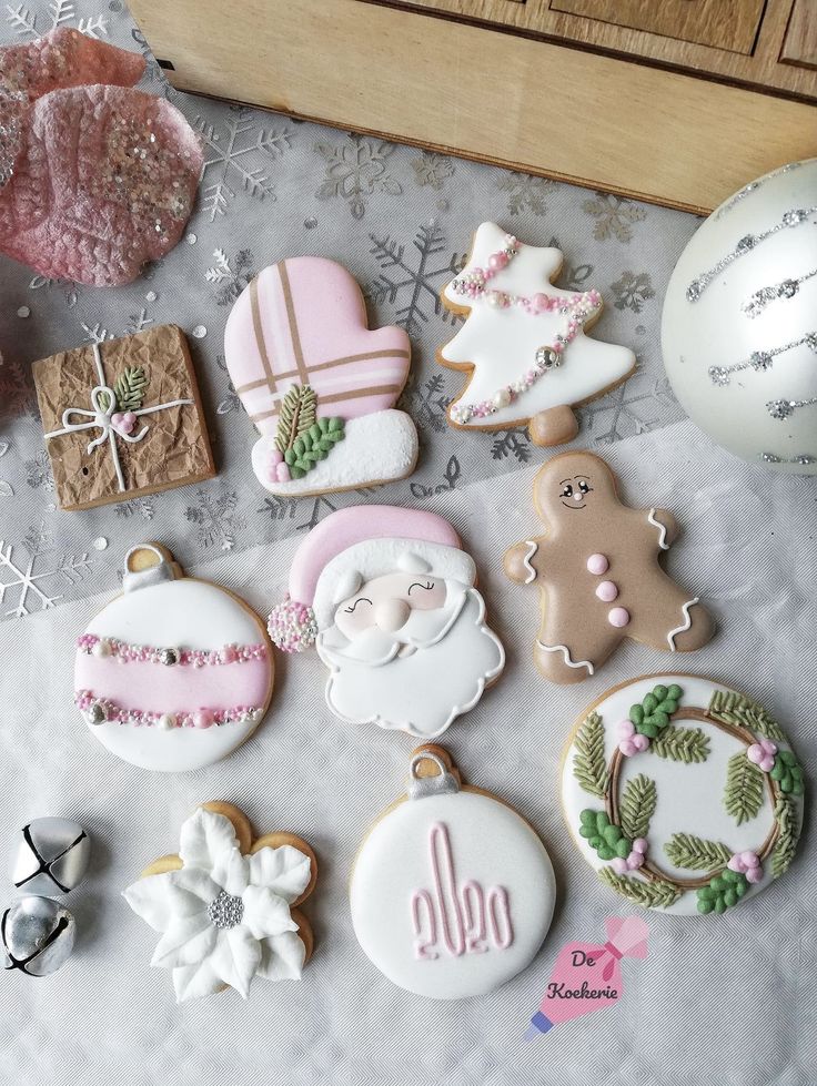 some decorated cookies are sitting on a table