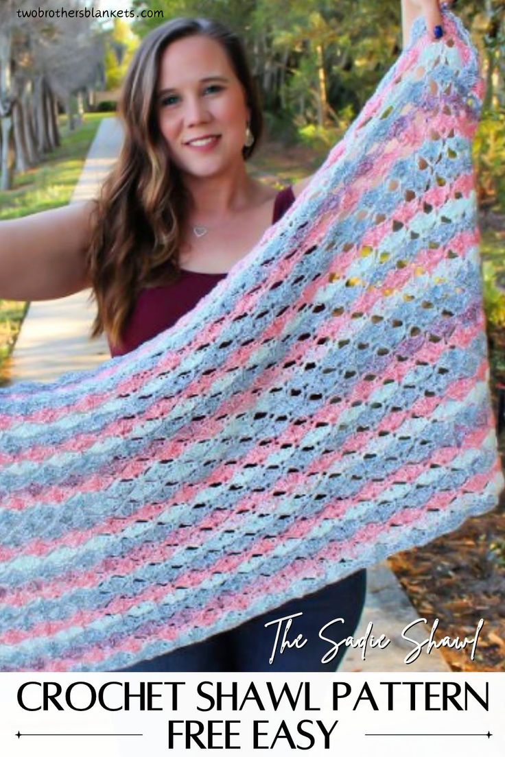 a woman holding up a crochet shawl with text that reads, the safe shade