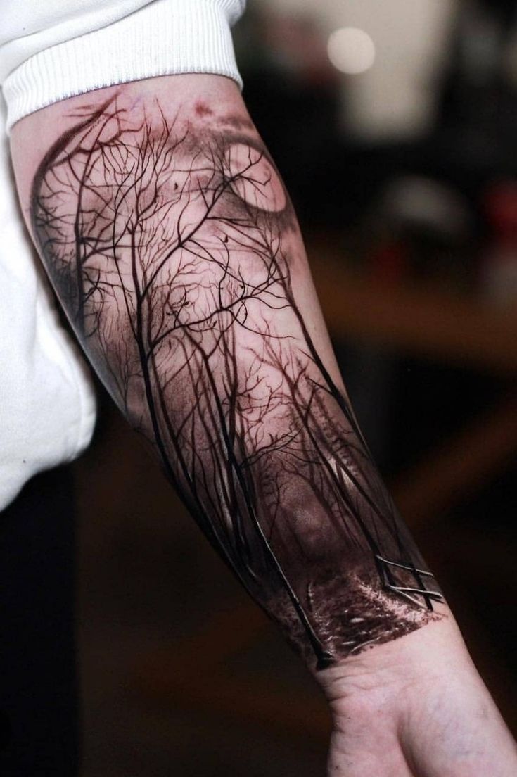 a person with a tree tattoo on their arm