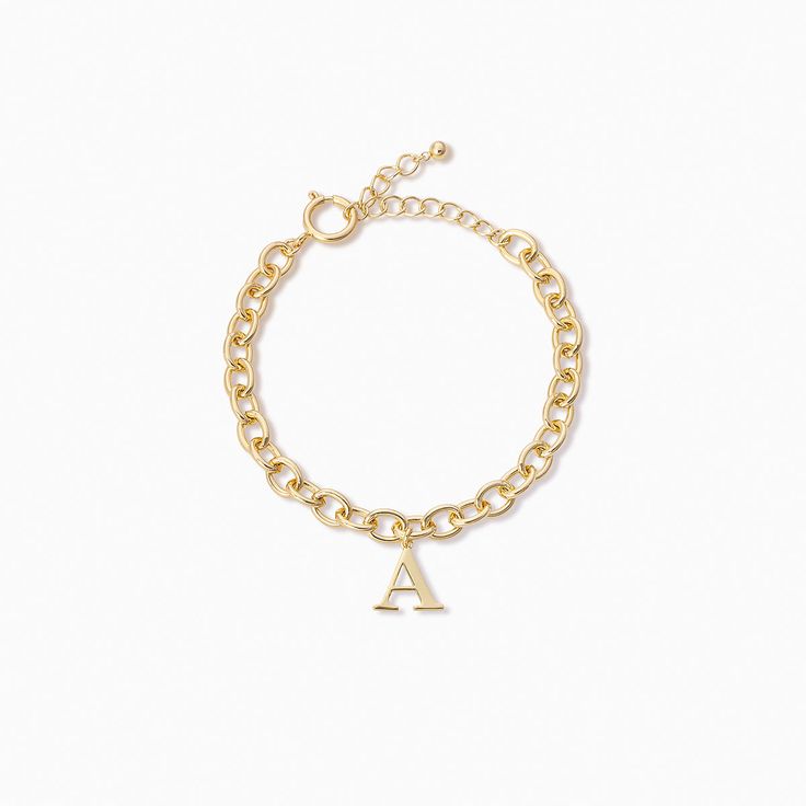 You’ll be unforgettable in this gold initial bracelet. Crafted from a gold chain bracelet and an initial pendant, our Remember Me Bracelet deserves a spot in your jewelry collection. For a fully personalized look, shop our Initial Jewelry Collection. Trendy Gold Name Bracelet For Personalized Gift, Trendy Personalized Gold Name Bracelet, Trendy Personalized Gold Chain Bracelet, Trendy Everyday Monogram Jewelry, Personalized Gold Name Bracelet With Adjustable Chain, Minimalist Monogram Bracelet For Everyday, Adjustable Gold Charm Bracelet With Initials, Everyday Personalized Gold-plated Charm Bracelet, Everyday Personalized Gold Plated Charm Bracelet