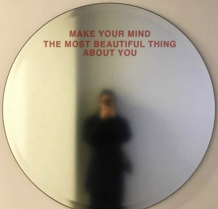 a mirror reflecting a person's reflection in it with the words make your mind the most beautiful thing about you