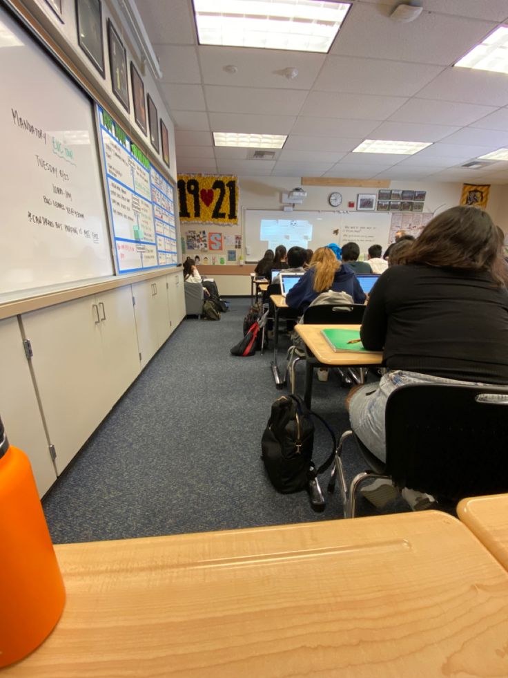 a classroom full of students sitting at desks