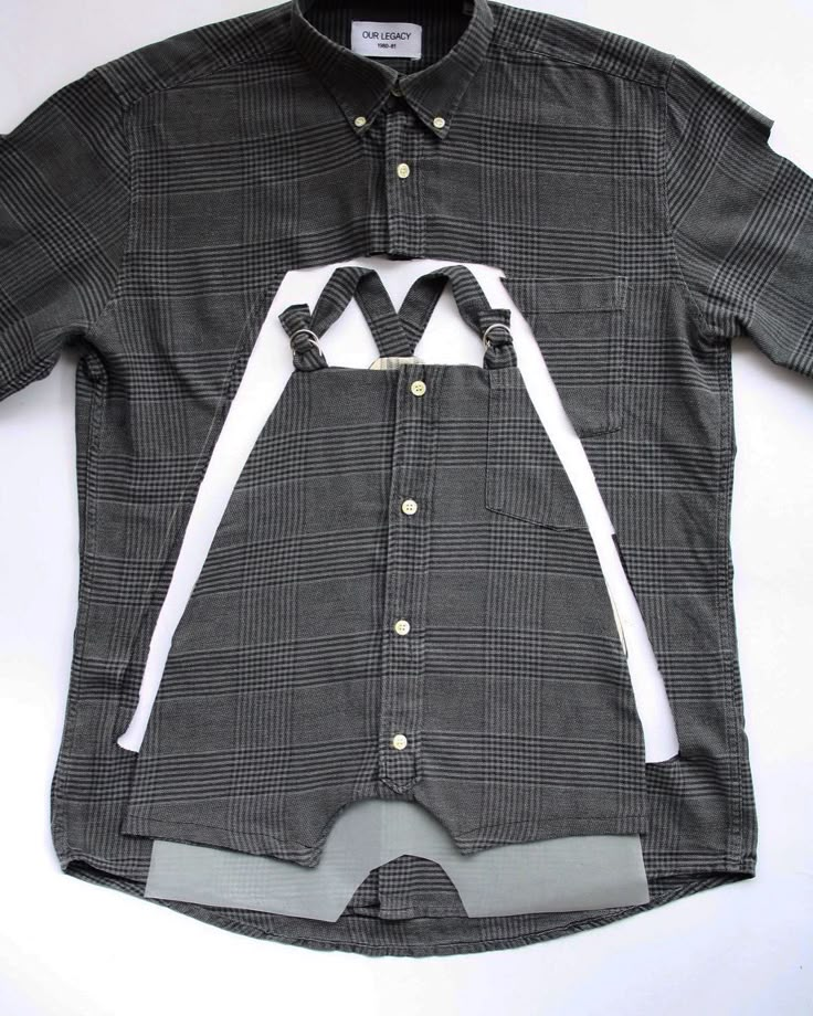 a black and white shirt with suspenders on it