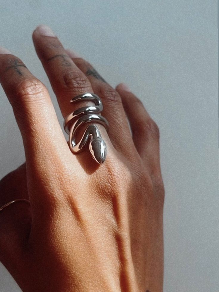 PRE ORDER SHIPS 12/1-12/10 This snake ring is a stunning addition to any collection. Embrace the transformative spirit of the serpent, symbolizing change and growth. It's a timeless statement piece that exudes sleek minimalism. Recycled Sterling Silver Waterproof Eco- Friendly Sustainable & Recycled Material Snake Ring Gold, Snake Goddess, Serpent Ring, Snake Ring Silver, Statement Ring Silver, Snake Ring, A Snake, Recycled Sterling Silver, Rings For Women