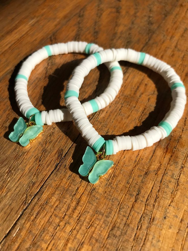 This bracelet is called butterfly bliss. It is made with white and teal clay beads. You can either chose the bracelet to how a butter charm like how it is in the photo or without the charm. If you have any questions message me. White Butterfly Charm Bracelet For Gift, White Butterfly Bracelet For Gift, White Beaded Butterfly Shaped Jewelry, White Beaded Butterfly-shaped Jewelry, White Beaded Butterfly Jewelry, White Everyday Jewelry With Butterfly Charm, Everyday White Jewelry With Butterfly Charm, Everyday White Butterfly Jewelry, Clay Beads Bracelet Ideas