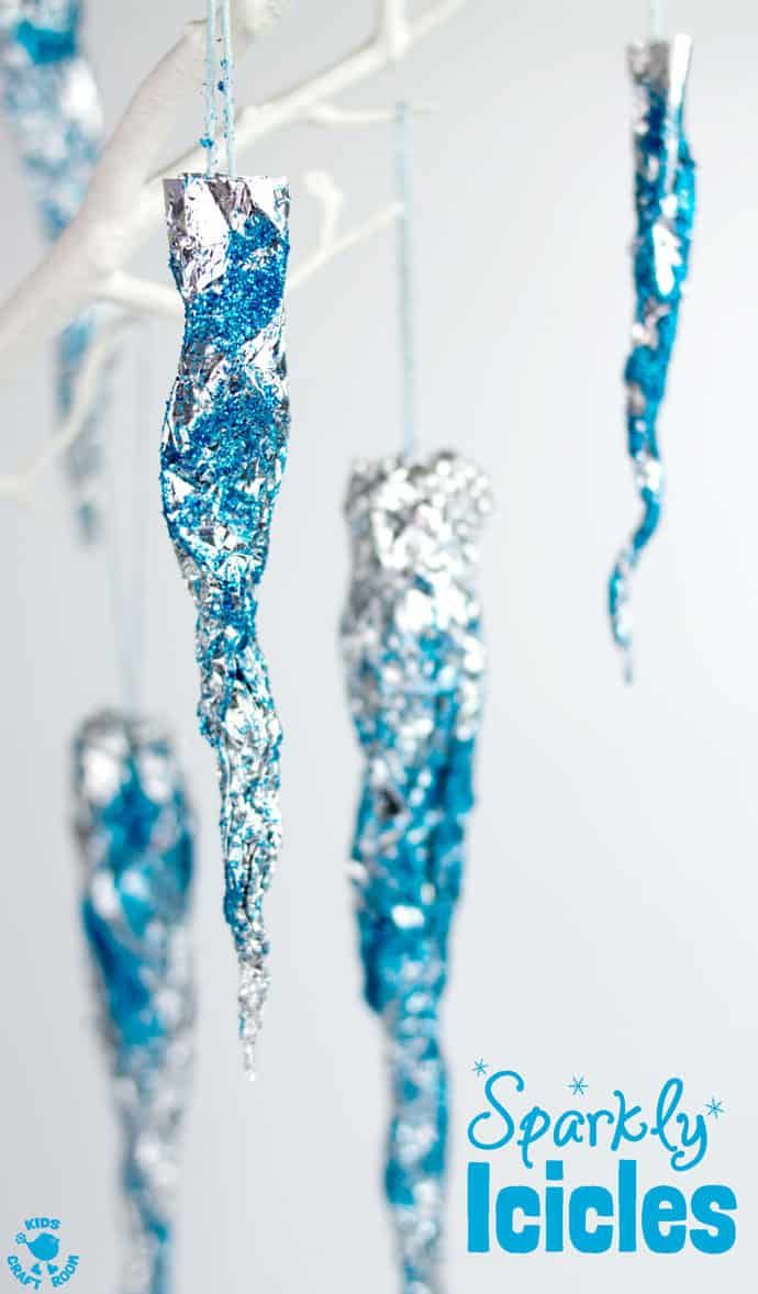 blue and silver ornaments hanging from a branch with the words spooky lights on it