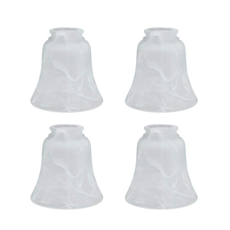 four white glass bells on a white background