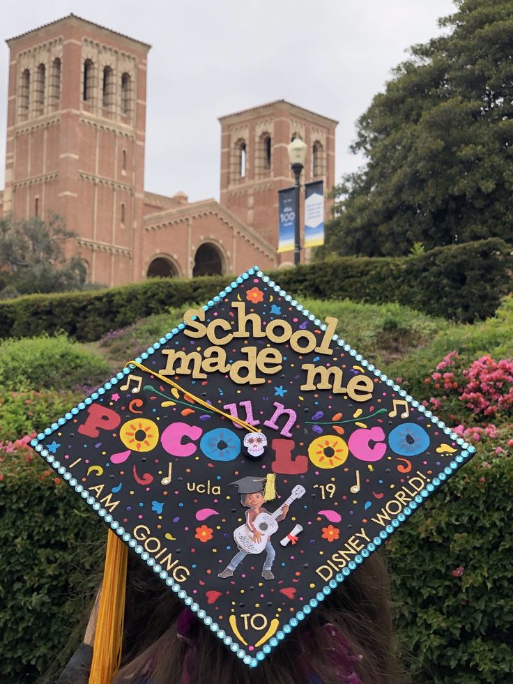 a person wearing a graduation cap with the words school made me on it's back