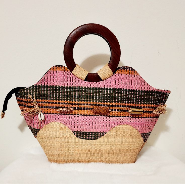 Woven African Hand-Made Bag. The Handel Bag Is Made With Wood. The Inside Has A 1 Zipper Closure Pocket And 1 Open Pocket. It Is New. Open For More Questions Large Capacity Pink Bag With Double Handle, Pink Large Capacity Bag With Double Handle, Pink Bags With Large Capacity And Double Handle, Pink Double Handle Bag With Large Capacity, Pink Rectangular Bag With Adjustable Strap, Large Capacity Pink Tote Shoulder Bag, Pink Large Capacity Rectangular Shoulder Bag, Pink Handheld Bag With Adjustable Strap, Pink Top Handle Shoulder Bag With Adjustable Strap