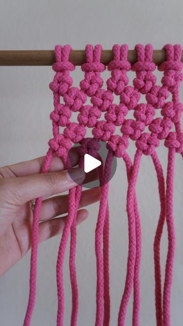 the video shows how to crochet an object with yarn and cotton in it