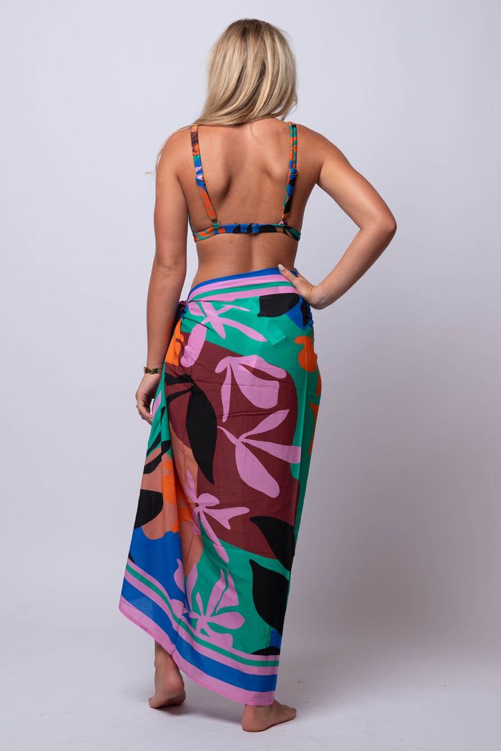 Unleash your inner beach goddess with our Ananya SARONG. Versatile and beachy, this sarong is perfect for all your summer adventures. Go from beach to bar in style with this must-have accessory. Fit Guide: One Size *available at our bandit location Multicolor Tie-side Swimwear For Vacation, Beachy Sarong For Vacation, Beachy Sarong For Vacation Beach Season, Summer Vacation Sarong With Tie-side Bottom, Vacation Beachy Sarong For Beach Season, Bohemian Tropical Print Sarong For Pool, Bohemian Sarong With Tropical Print For Pool, Bohemian Sarong With Tropical Print For Beach Season, Bohemian Wrap Swimwear For Vacation