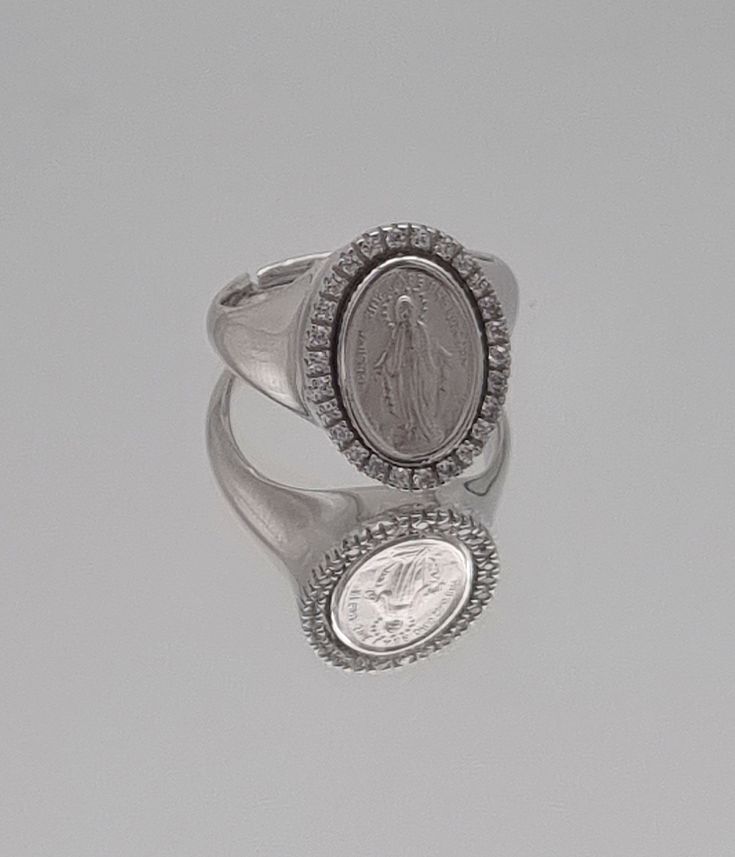 925 sterling silver,  Virgin Mary Signet Band Ring is a style complement. Miraculous medal ring. All details have been considered to make it the most meaningful and eye-catching gift.  This piece of jewelry will give you special pleasure. Ring Weight: 7,70 grams Ring size: adjustable  the smallest size is : US:6-, EU:15, Diameter 54mm Can be expanded to larger sizes Luxury Silver Signet Ring With Halo Setting, Fine Jewelry Sterling Silver Signet Ring With Vvs Clarity, Sterling Silver Signet Ring With Vvs Clarity, Silver Diamond Engraved Signet Ring, Luxury Silver Open Signet Ring, Sterling Silver Signet Ring Fine Jewelry, Hallmarked White Gold Signet Ring With Cubic Zirconia, Silver Cubic Zirconia Signet Ring In Fine Jewelry Style, Silver Diamond Signet Ring Gift