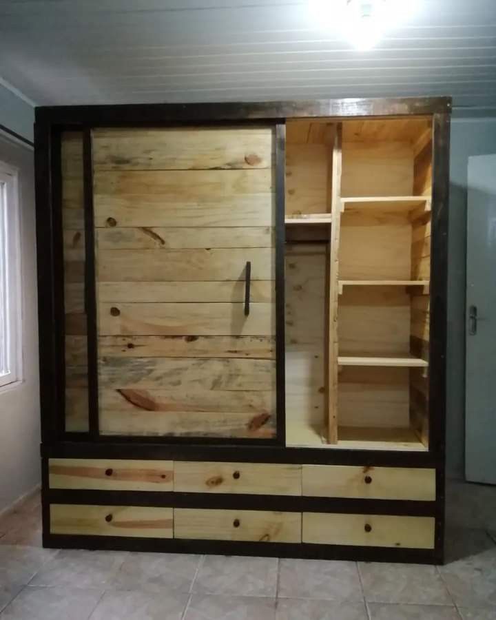 a large wooden cabinet sitting inside of a room