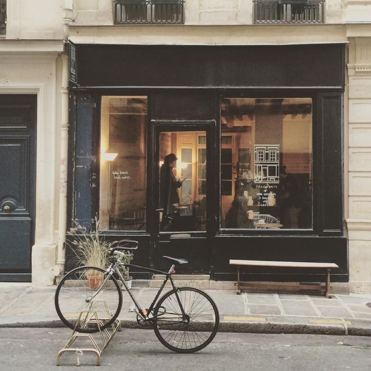 a bicycle parked in front of a store