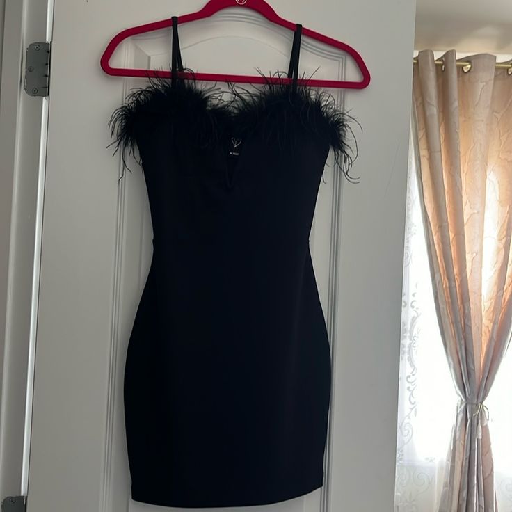 Black Mini Dress With Feather Detail. Never Worn, No Tag. Great Condition! Cute For A Night Out! Feathered Mini Dress For Date Night, Black Feather Dresses For Night Out, Black Dress With Feather Trim For Date Night, Black Mini Dress With Feathers For Party Season, Black Feathered Dresses For Night Out, Black Feather Trim Dress For Date Night, Black Mini Dress With Feather Trim For Date Night, Black Feather Trim Dress For Night Out, Black Feathered Mini Party Dress