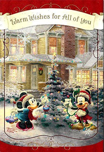 a christmas card with mickey and minnie mouses in front of a house that says warm wishes for all of you