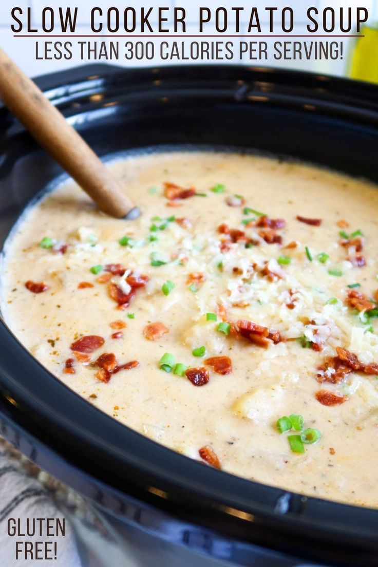 slow cooker potato soup in a crock pot with text overlay that reads slow cooker potato soup less than 300 calories per serving