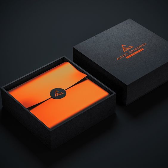 an orange and black box with a logo on the inside that is attached to it