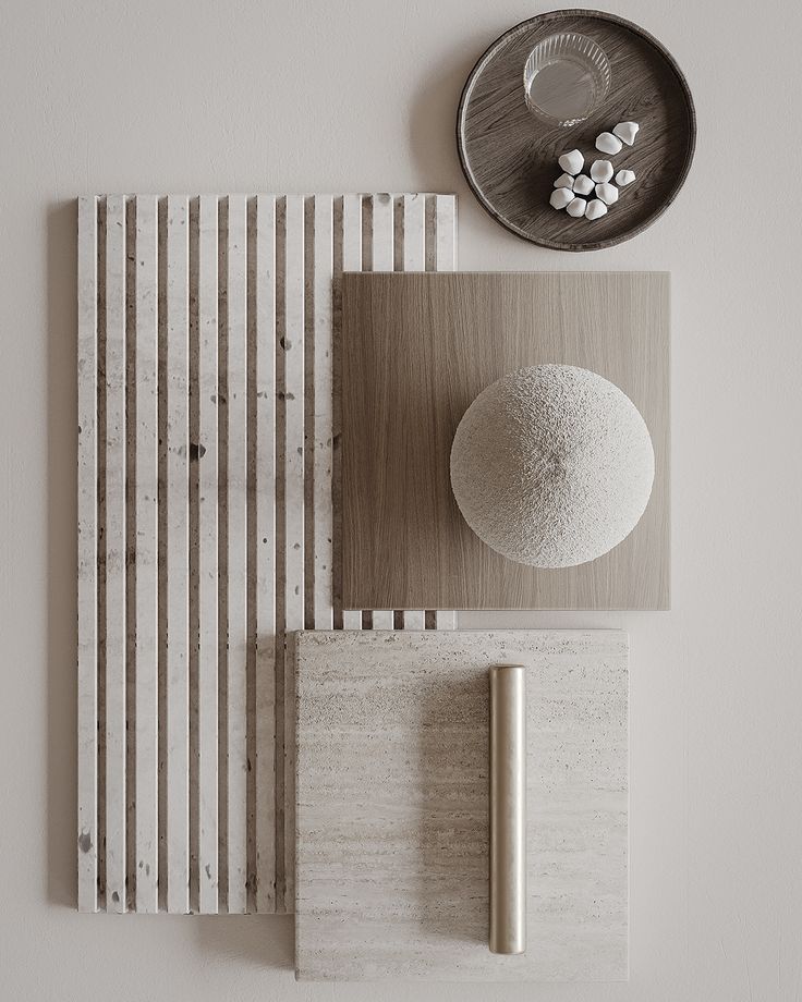 an arrangement of objects on a table with a plate and spoon