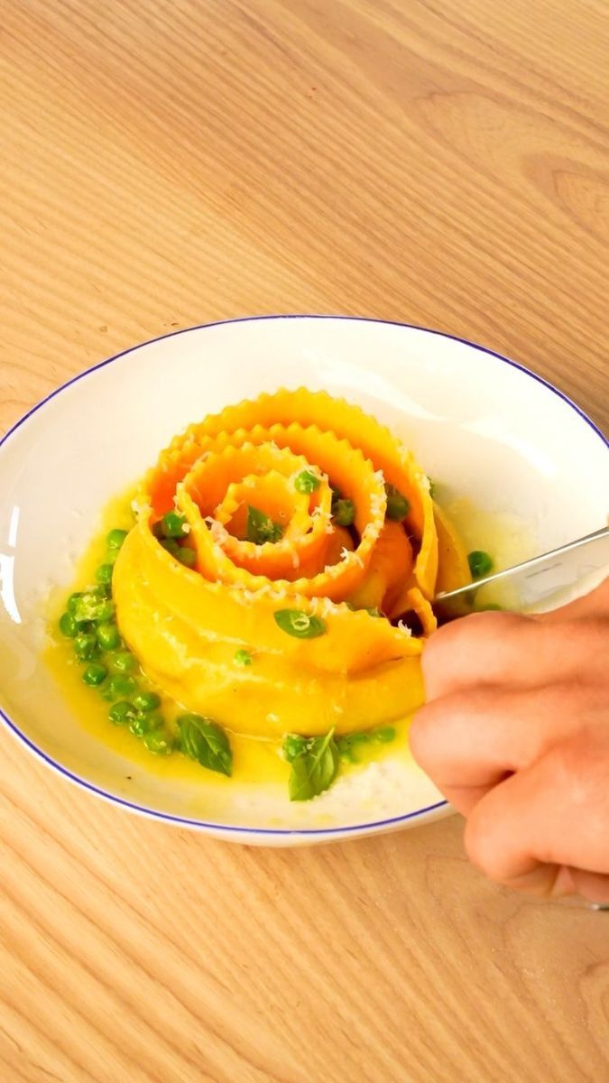 a person is cutting up some food on a plate