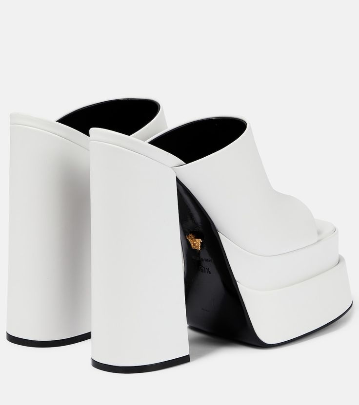 Leather platform mules in white - Versace | Mytheresa Luxury White Mules With Sculpted Heel, Modern White Mules With Sculpted Heel, White Luxury Formal Mules, Luxury White Square Toe Sandals, Luxury White Mules For Evening, Luxury White Evening Mules, Luxury Leather Platform Slides, Designer White Open Heel Mules, White Platform Heels With Square Toe