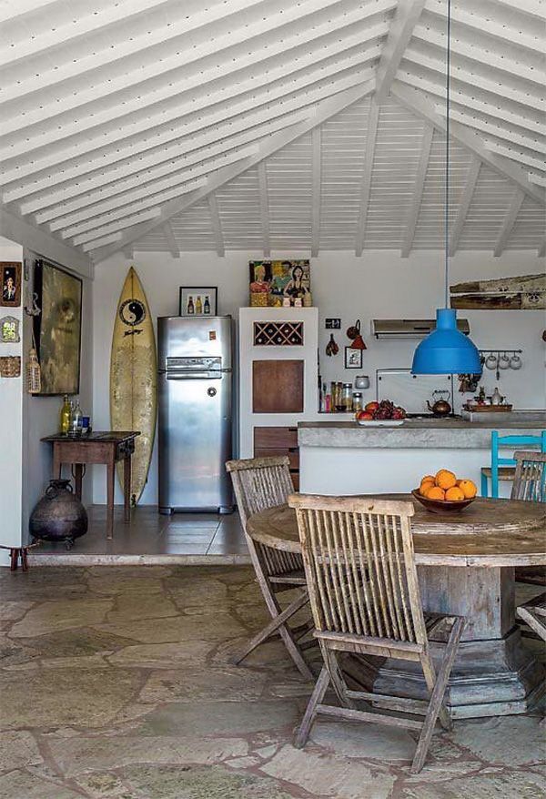 a kitchen with a table and chairs in it