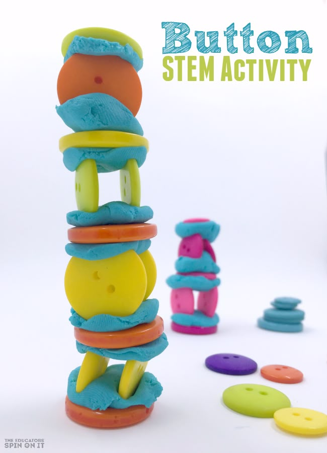 a stack of colorful buttons sitting on top of a white table next to other toys