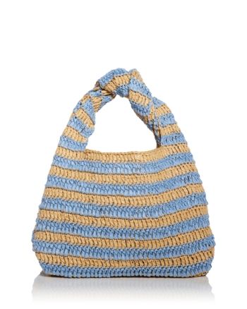 a blue and yellow handbag with a knotted handle on the front, sitting against a white background