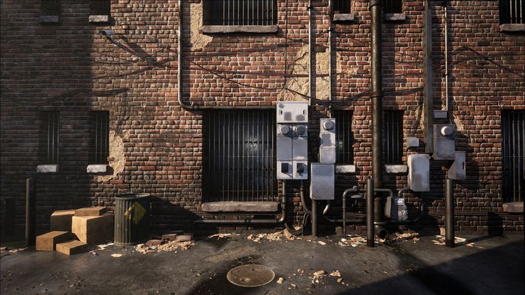 an old brick building with lots of electrical wires and boxes on the ground next to it