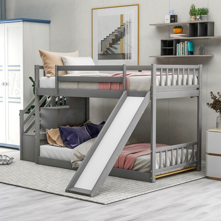 a bunk bed with a slide next to it in a room filled with furniture and decor