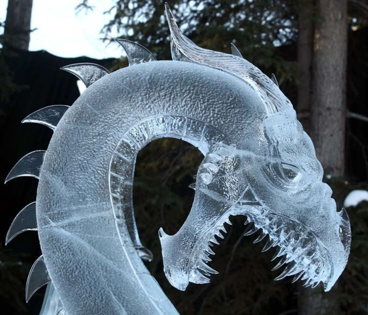 an ice sculpture of a dragon with its mouth open