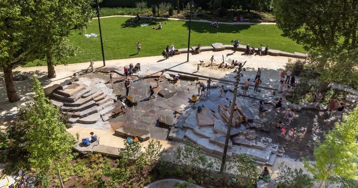 an aerial view of people playing in the park