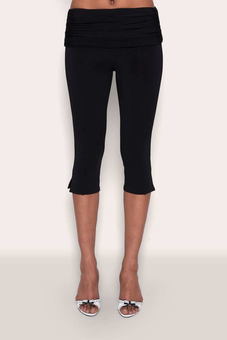 Designed to become a staple in your wardrobe, our matte jersey low-rise capri pants feature a flattering elastic ruched waistband and flare slits at the hem that add a stylish detail. Composition: 92% Polyester, 8% Spandex Dani is wearing a size S and is 5'10" with a 32" bust, 35" hips, and 25" waist Chic Stretch Knee-length Pants, Chic Elastane Activewear, Stretch Mid-thigh Length Bottoms For Work, Stretch Mid-thigh Length Workwear Bottoms, Comfort Stretch Elastane Bottoms Short Length, Spring Elastane Capri Pants, Spring Capri Pants In Elastane, Fitted Cropped Leg Elastane Bottoms, Fitted Cropped Elastane Bottoms