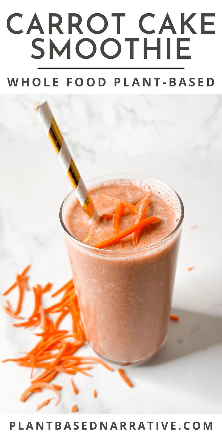 carrot cake smoothie in a glass with a straw sticking out of it and shredded carrots on the side