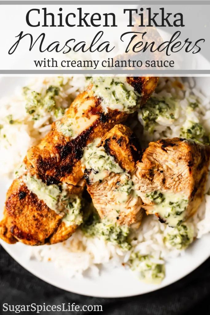 chicken tika masala tenders with creamy cilantro sauce on a white plate