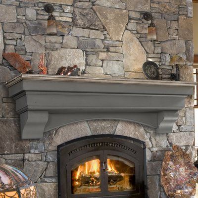 a stone fireplace with an open fire place