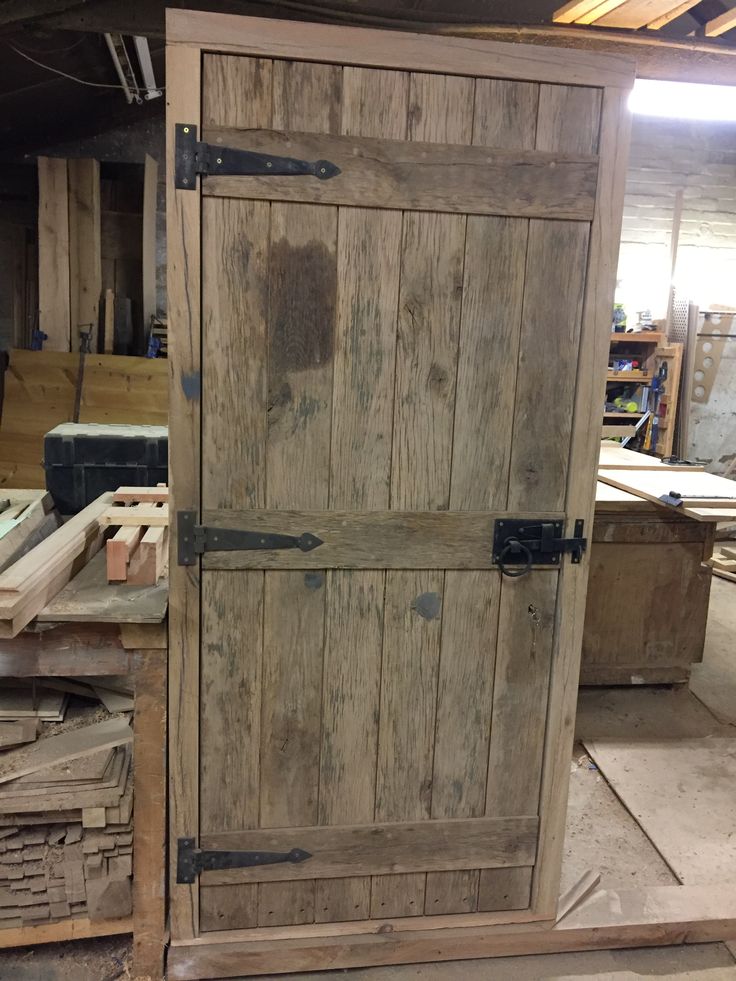 an old wooden door is being worked on