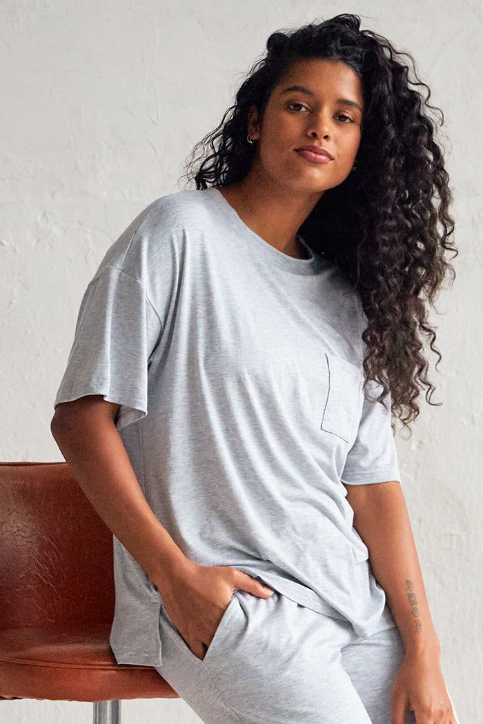 Aishah is 5'7" Oversized Casual T-shirt For Daywear, Relaxed Fit Short Sleeve T-shirt For Daywear, Effortless Short Sleeve T-shirt For Loungewear, Solid Relaxed Fit T-shirt For Loungewear, Solid Color Relaxed Fit Short Sleeve Top For Loungewear, Relaxed Fit Short Sleeve Top For Loungewear, Boxy Fit T-shirt With Drop Shoulder For Loungewear, Relaxed Fit T-shirt With Curved Hem For Everyday, Boxy Fit Drop Shoulder T-shirt For Loungewear