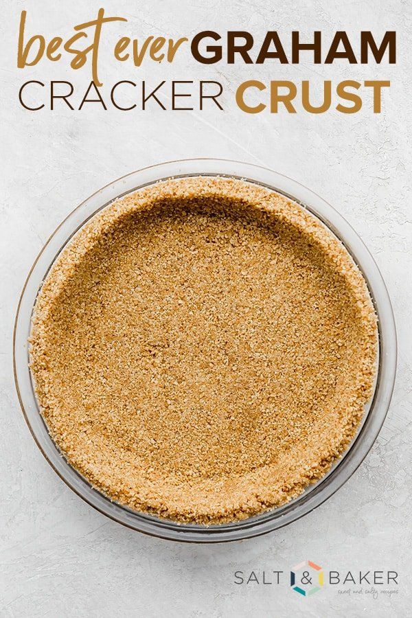 the best ever graham cracker crust recipe in a glass bowl on a white background