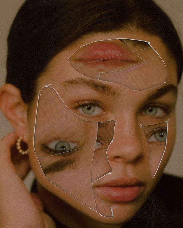 a woman with cutouts on her face looking at the camera